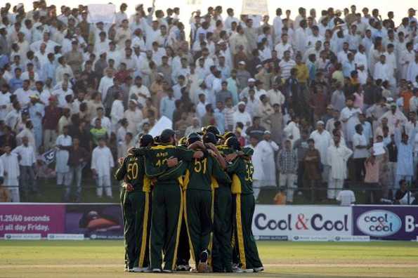 Pakistan's players celebrate after taking the wicket of New Zealand's Daniel Vettori during their second one-day international cricket match in Abu Dhabi. New Zeland's Brendon McCullum hit a return-to-form hundred and Scott Styris took three wickets in two overs as New Zealand beat Pakistan by 64 runs