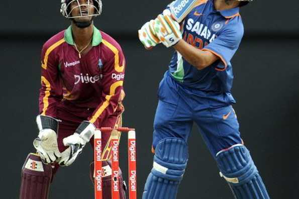 India's Gautam Gambhir (R) plays a shot during the the third one-day international at the Beausejour cricket ground in Gros-Islet, St. Lucia, on July 3. India are now one step away from a rare One-day International series victory in the Caribbean.