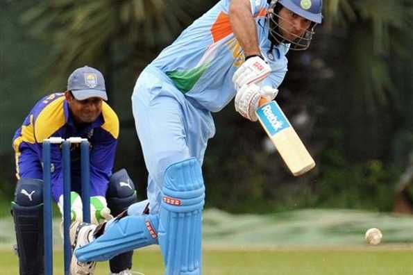 Indian cricketer Yuvraj Singh (right) watches the ball after playing a stroke during the One Day practice match between Indian and Sri Lankan XI team in Colombo. Singh geared up for the one-day series against Sri Lanka with an explosive 172 to power India to a comfortable 92-run victory in a practice match.