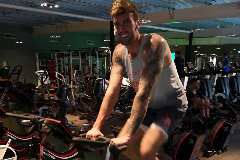 Topley during an early rehab session at a gym in Colchester. He would spend an hour on the bike watching Netflix.