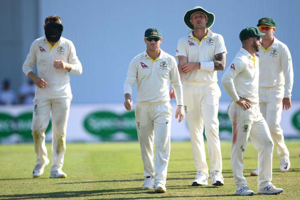 A distraught Australia trudge off after the loss