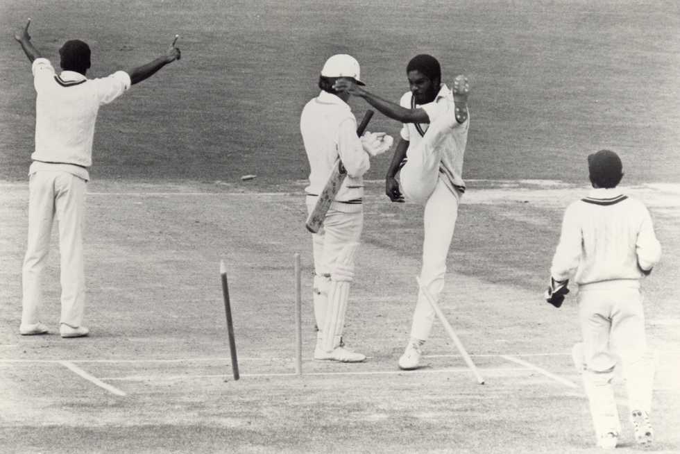 Michael Holding kicks over the stumps in frustration after a decision for caught behind is turned down during the First Test against New Zealand in Dunedin, 1980