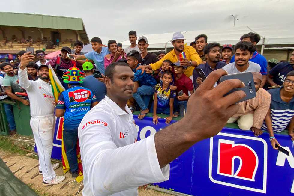 Angelo Mathews clicks a picture with fans at Galle