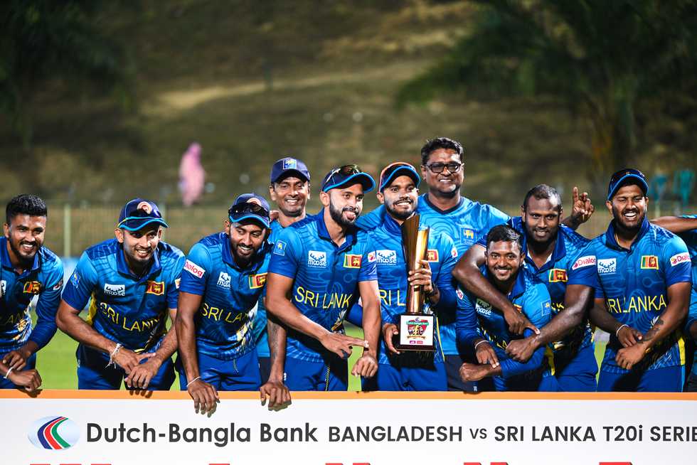 Sri Lanka celebrate the series win with the 'timed-out' gesture.