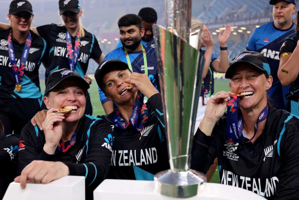 The three senior pros of New Zealand women's cricket - Lea Tahuhu, Suzie Bates, and Sophie Devine - celebrating their maiden World Cup win